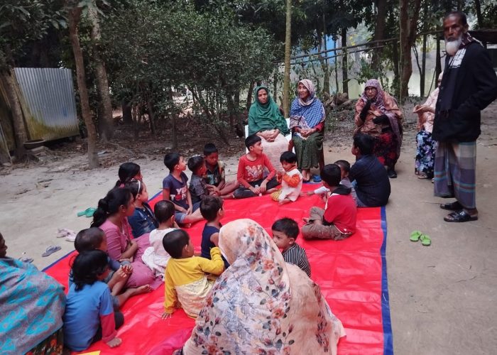 Story telling session going on between grandparents and grandchildren